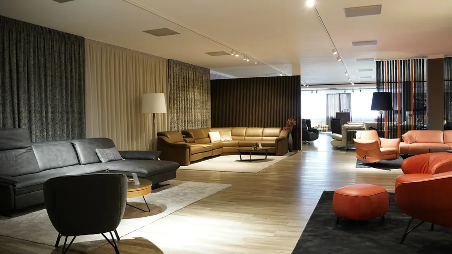 A furniture showroom floor with sofas and lighting